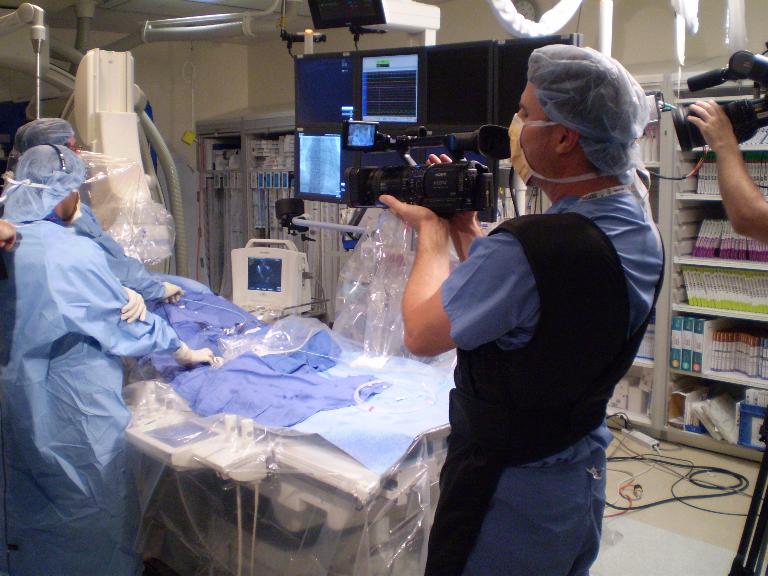 Paul videotapes a medical procedure.
